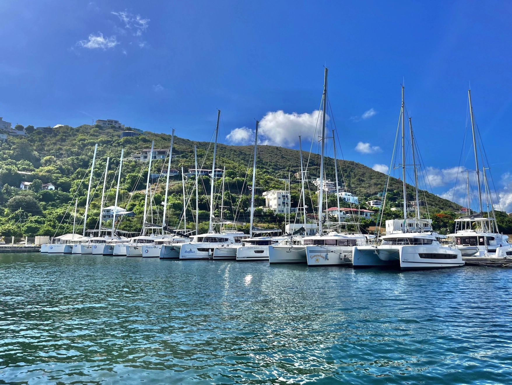 The Catamaran Company fleet of catamarans moored at the marina in the British Virgin Islands